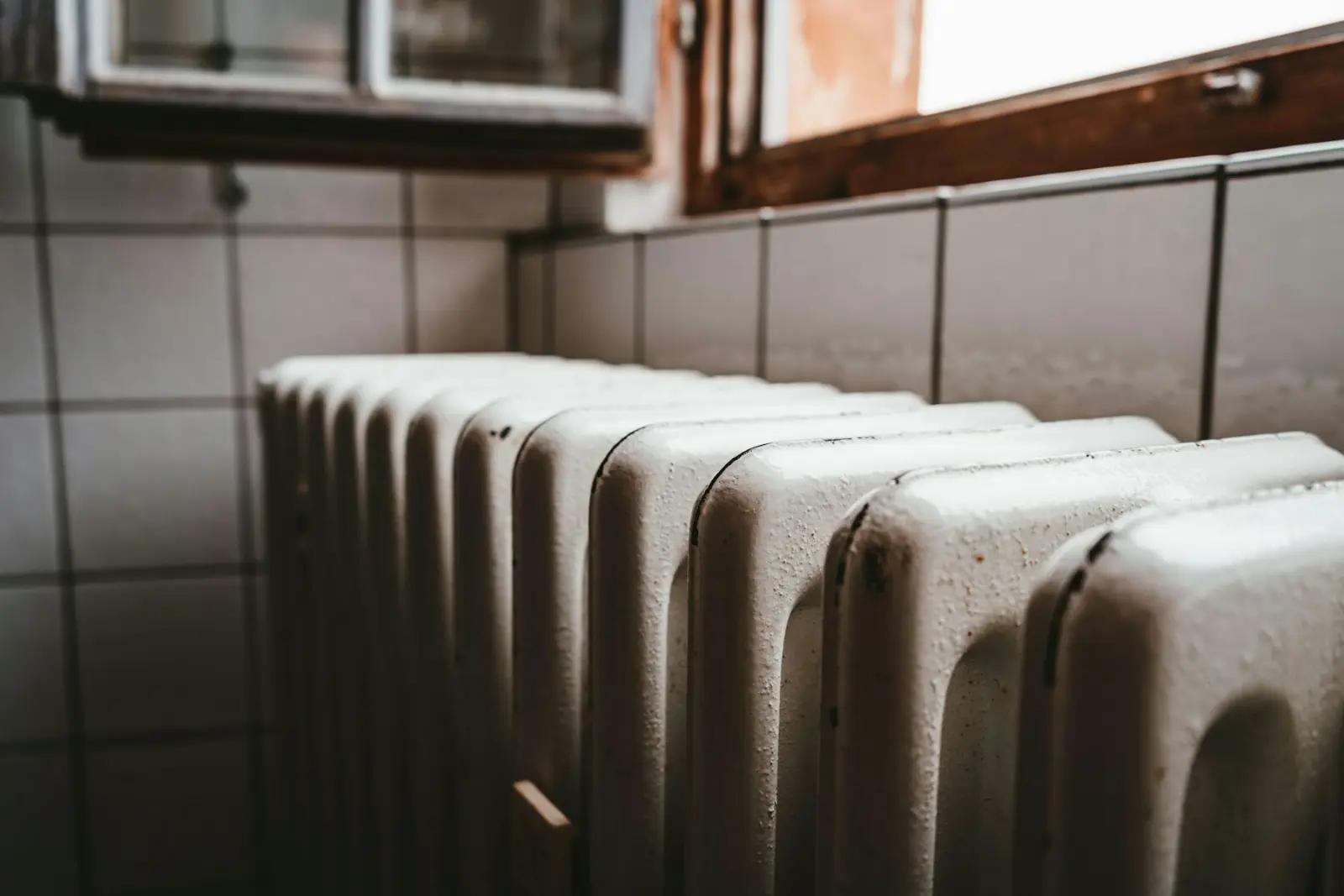 A white radiator beside a window